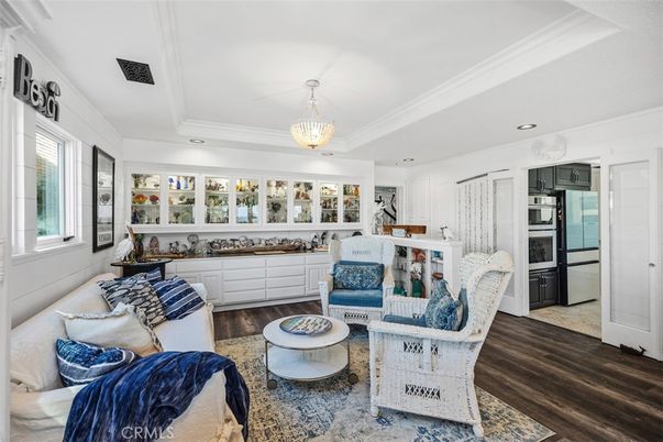 Chandelier, Interior, Kitchen, Living room, Pendant Lights, Recessed Lighting, Stainless Steel Appliances, Wood Texture Flooring