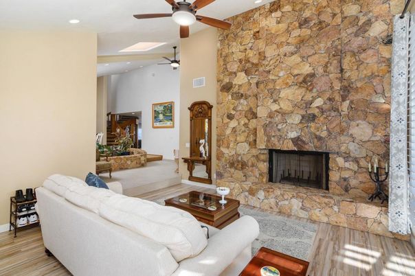 Fireplace, Interior, Living room, Recessed Lighting, Stone Walls, Wood Texture Flooring