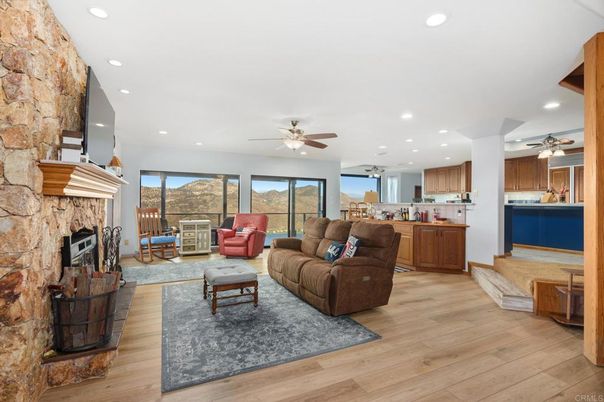 Fireplace, Interior, Kitchen, Living room, Recessed Lighting, Stone Walls, Wood Texture Flooring