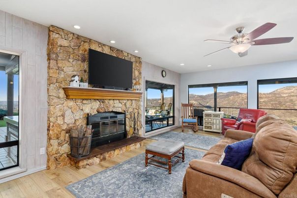 Fireplace, Interior, Living room, Recessed Lighting, Stone Walls, Wood Texture Flooring