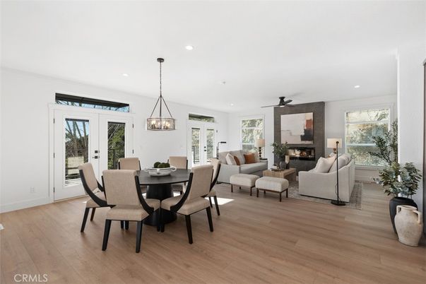 Dining room, Fireplace, Interior, Living room, Pendant Lights, Recessed Lighting, Wood Texture Flooring