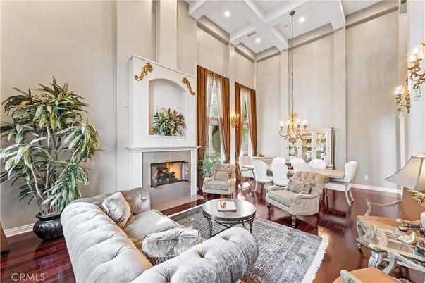 Chandelier, Dining room, Fireplace, Interior, Living room, Pendant Lights, Recessed Lighting, Wood Texture Flooring