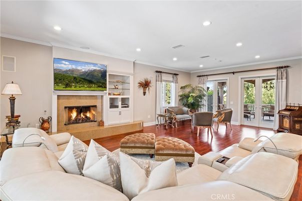 Dining room, Fireplace, Interior, Living room, Recessed Lighting, Wood Texture Flooring