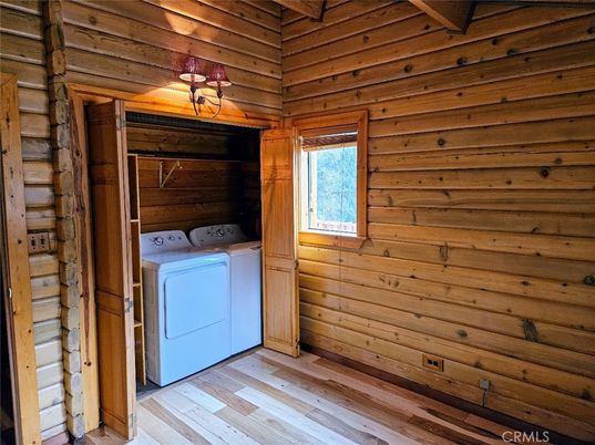 Interior, Utility Closets, Washer, Wood Texture Flooring, Wooden Walls