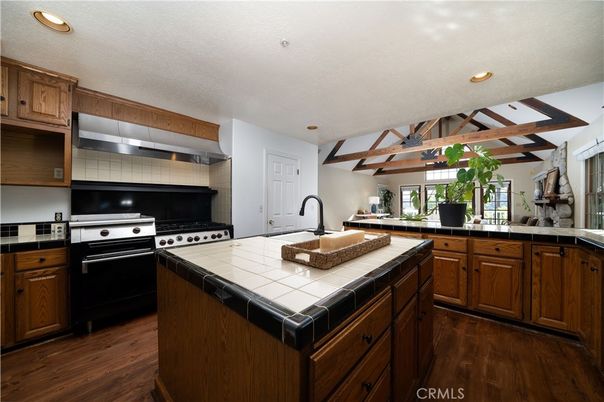 Interior, Kitchen, Recessed Lighting, Stainless Steel Appliances, Tile Countertops, Wooden Beams, Wood Texture Flooring
