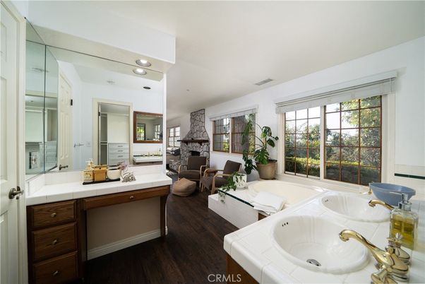 Bathroom, Dual Sink Vanities, Fireplace, Interior, Living room, Recessed Lighting, Tile Countertops, Wood Texture Flooring