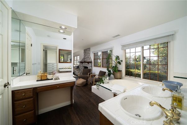 Bathroom, Dual Sink Vanities, Fireplace, Interior, Living room, Recessed Lighting, Tile Countertops, Wood Texture Flooring