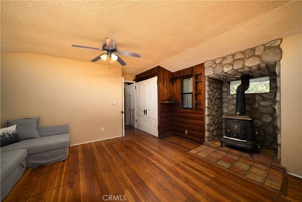 Empty room, Fireplace, Interior, Stone Walls, Wood Texture Flooring