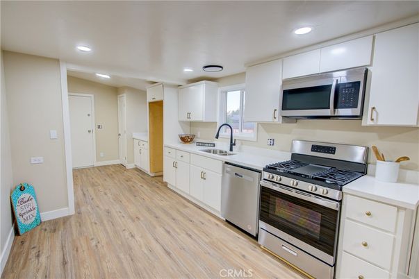 Interior, Kitchen, Recessed Lighting, Stainless Steel Appliances, Wood Texture Flooring