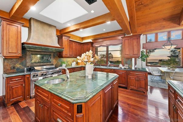 Chandelier, Dining room, Interior, Kitchen, Recessed Lighting, Stainless Steel Appliances, Wooden Beams, Wooden Ceilings, Wood Texture Flooring