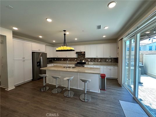 Chandelier, Interior, Kitchen, Pendant Lights, Recessed Lighting, Stainless Steel Appliances, Wood Texture Flooring