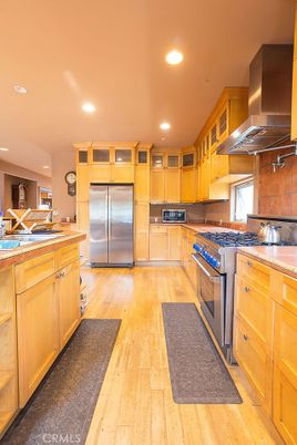 Interior, Kitchen, Recessed Lighting, Stainless Steel Appliances, Tile Countertops, Wood Texture Flooring