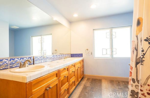 Bathroom, Dual Sink Vanities, Interior, Recessed Lighting, Tile Countertops, Wood Texture Flooring