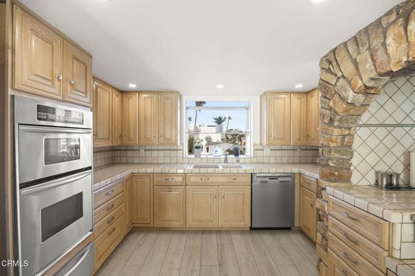 Interior, Kitchen, Recessed Lighting, Stainless Steel Appliances, Tile Countertops, Wood Texture Flooring