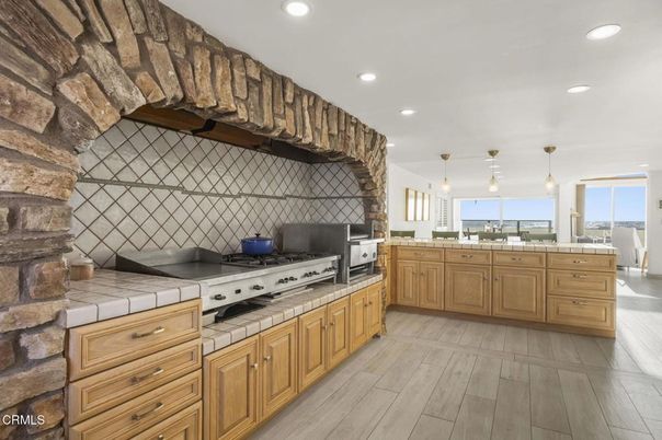 Interior, Kitchen, Pendant Lights, Recessed Lighting, Stainless Steel Appliances, Tile Countertops, Wood Texture Flooring