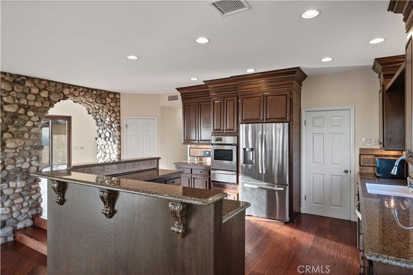 Interior, Kitchen, Recessed Lighting, Stainless Steel Appliances, Stone Walls, Wood Texture Flooring