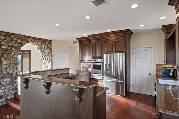 Interior, Kitchen, Recessed Lighting, Stainless Steel Appliances, Stone Walls, Wood Texture Flooring
