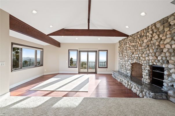 Empty room, Fireplace, Interior, Recessed Lighting, Stone Walls, Wooden Beams, Wood Texture Flooring