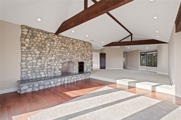 Empty room, Fireplace, Interior, Recessed Lighting, Stone Walls, Wooden Beams, Wood Texture Flooring