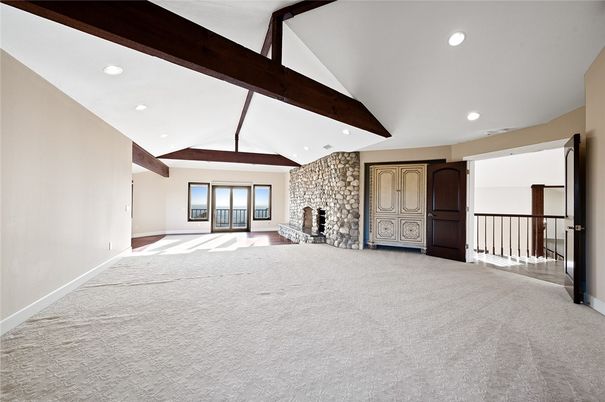 Empty room, Fireplace, Interior, Recessed Lighting, Stone Walls, Wooden Beams