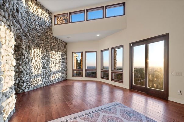 Empty room, Fireplace, Interior, Recessed Lighting, Stone Walls, Wood Texture Flooring