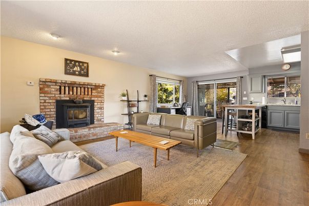 Fireplace, Fitness Equipment, Interior, Living room, Recessed Lighting, Wood Texture Flooring
