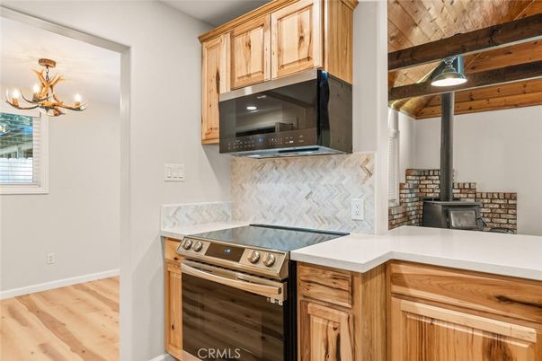 Fireplace, Interior, Kitchen, Stainless Steel Appliances, Wooden Beams, Wooden Ceilings, Wood Texture Flooring
