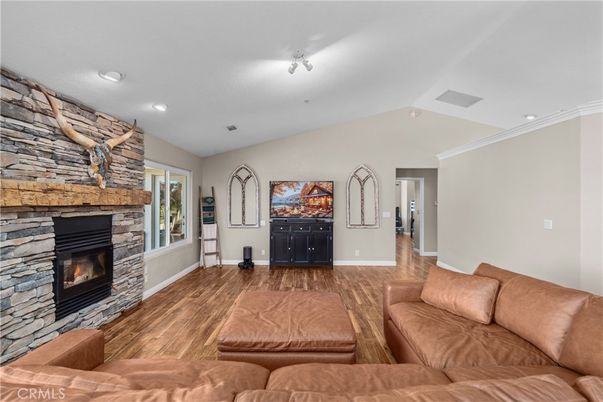 Fireplace, Interior, Living room, Recessed Lighting, Stone Walls, Wood Texture Flooring