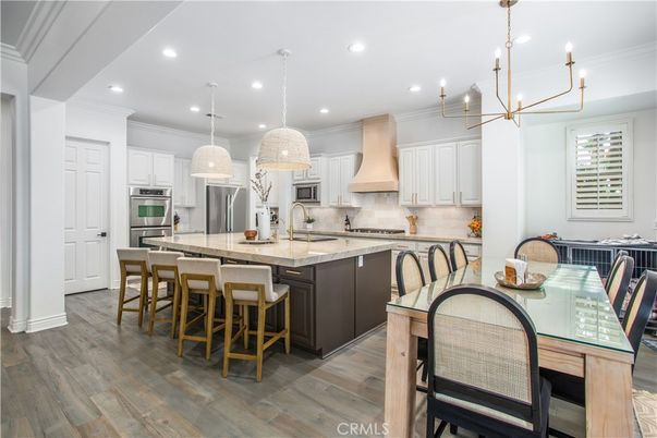 Dining room, Interior, Kitchen, Pendant Lights, Recessed Lighting, Stainless Steel Appliances, Wood Texture Flooring