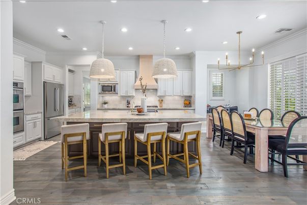 Dining room, Interior, Kitchen, Pendant Lights, Recessed Lighting, Stainless Steel Appliances, Wood Texture Flooring