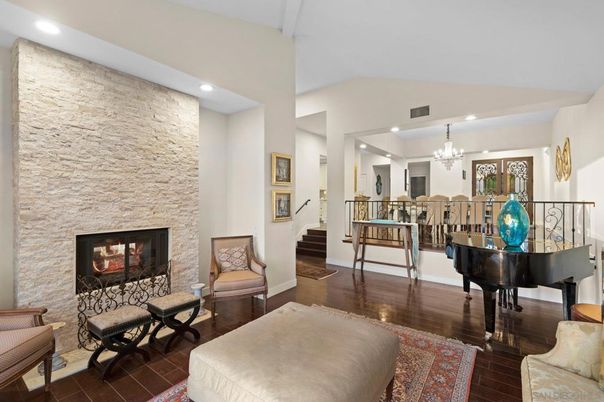 Chandelier, Fireplace, Interior, Piano, Recessed Lighting, Stone Walls, Wood Texture Flooring