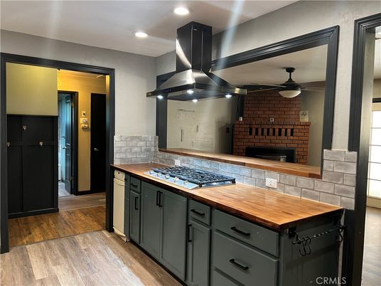 Fireplace, Interior, Kitchen, Recessed Lighting, Stone Walls, Wood Texture Flooring