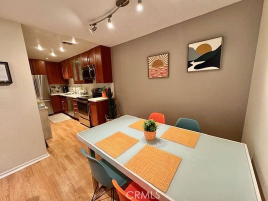Dining room, Interior, Kitchen, Recessed Lighting, Stainless Steel Appliances, Wood Texture Flooring