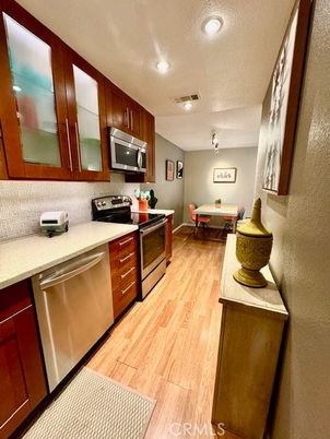 Dining room, Interior, Kitchen, Recessed Lighting, Stainless Steel Appliances, Wood Texture Flooring