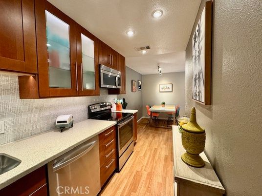 Dining room, Interior, Kitchen, Recessed Lighting, Stainless Steel Appliances, Wood Texture Flooring