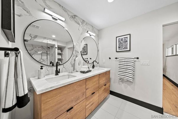 Bathroom, Dual Sink Vanities, Interior, Marble Walls, Recessed Lighting, Wood Texture Flooring