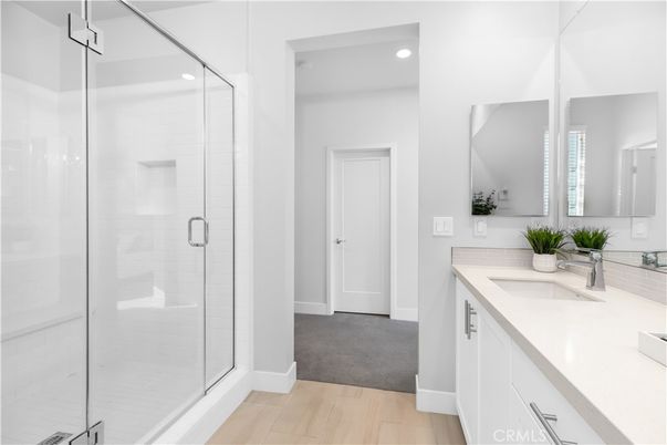 Bathroom, Dual Sink Vanities, Glass Shower, Interior, Recessed Lighting, Wood Texture Flooring
