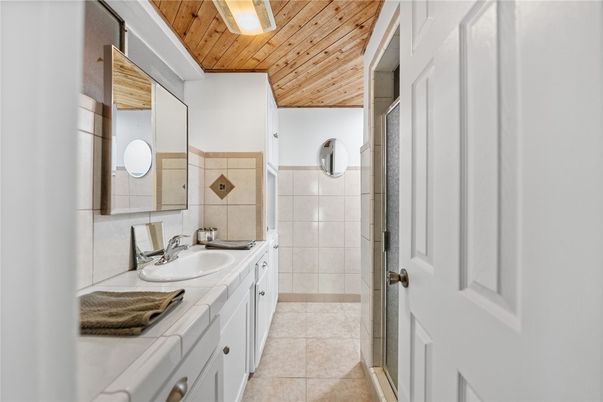 Bathroom, Dual Sink Vanities, Interior, Tile Countertops, Wooden Ceilings