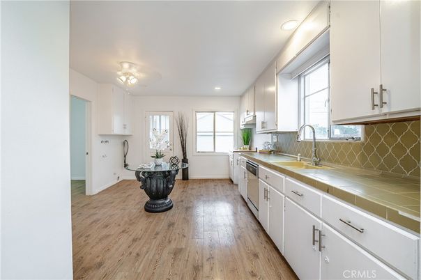 Interior, Kitchen, Recessed Lighting, Tile Countertops, Wood Texture Flooring