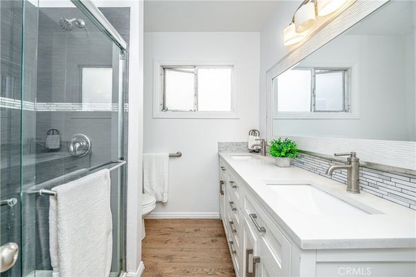 Bathroom, Dual Sink Vanities, Glass Shower, Interior, Wood Texture Flooring