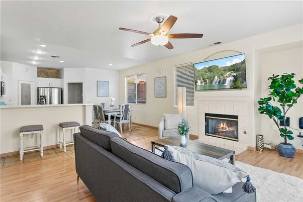 Dining room, Fireplace, Interior, Kitchen, Living room, Recessed Lighting, Stainless Steel Appliances, Wood Texture Flooring