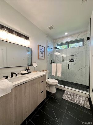 Bathroom, Dual Sink Vanities, Glass Shower, Interior, Marble, Marble Walls, Recessed Lighting