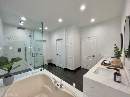 Bathroom, Dual Sink Vanities, Glass Shower, Interior, Marble Walls, Recessed Lighting