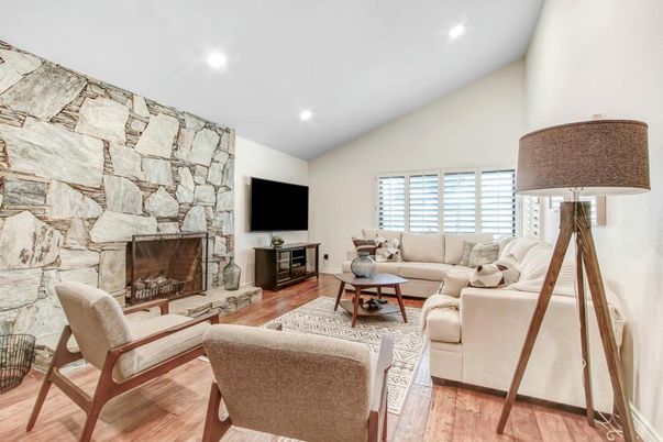 Fireplace, Interior, Living room, Recessed Lighting, Stone Walls, Wood Texture Flooring