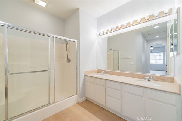 Bathroom, Dual Sink Vanities, Glass Shower, Interior, Recessed Lighting, Wood Texture Flooring