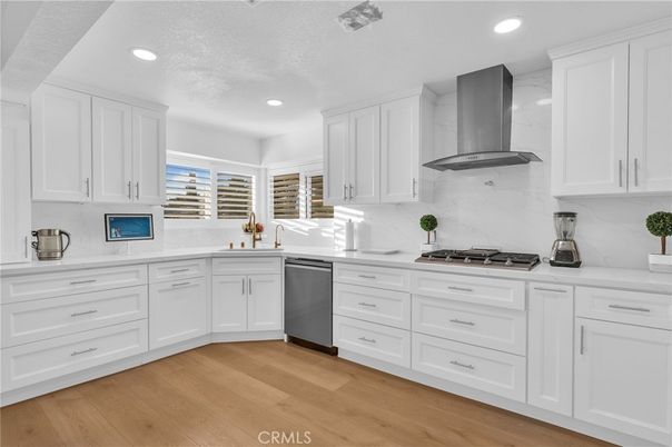 Interior, Kitchen, Marble Walls, Recessed Lighting, Stainless Steel Appliances, Wood Texture Flooring