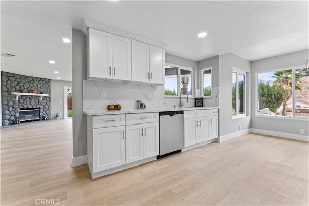 Fireplace, Interior, Kitchen, Recessed Lighting, Stone Walls, Wood Texture Flooring