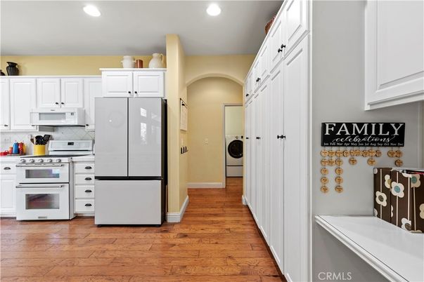 Interior, Kitchen, Recessed Lighting, Utility Closets, Washer, Wood Texture Flooring
