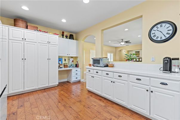 Interior, Kitchen, Recessed Lighting, Tile Countertops, Wood Texture Flooring