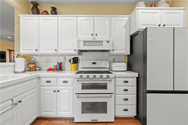 Interior, Kitchen, Tile Countertops, Wood Texture Flooring